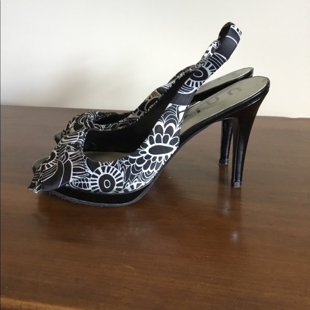 Beautiful black/ white floral sling-backs. 3 for $15.